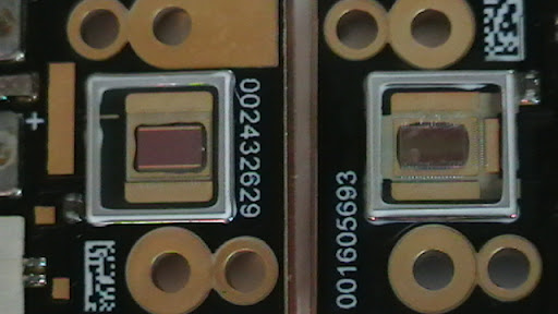 Two red LEDS side by side, the one on the right has burnt out.